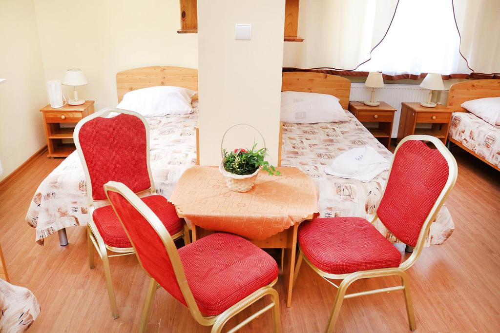 Postel nebo postele na pokoji v ubytování Ośrodek Wypoczynkowy Gryf II