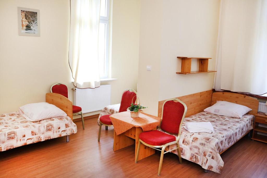 Postel nebo postele na pokoji v ubytování Ośrodek Wypoczynkowy Gryf II