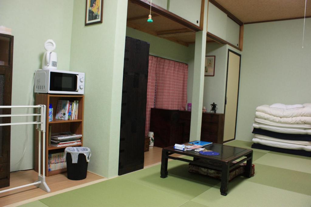 Postel nebo postele na pokoji v ubytování Guesthouse Seiryu Kibako