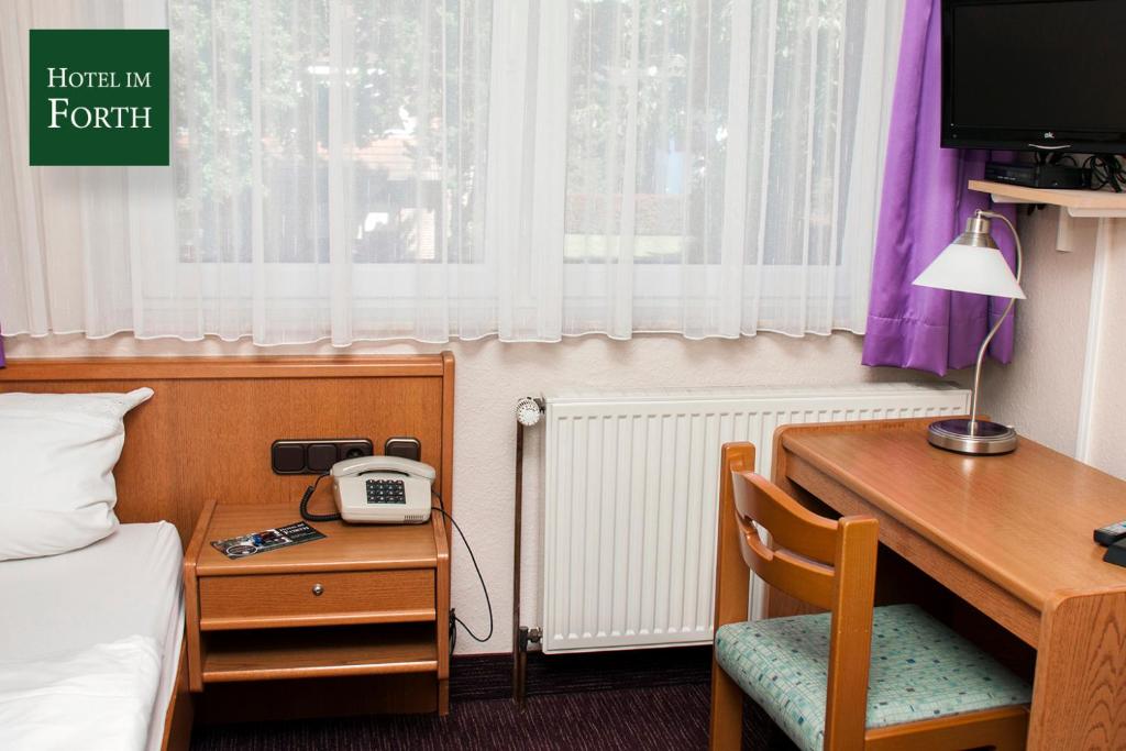TV a/nebo společenská místnost v ubytování Hotel im Forth