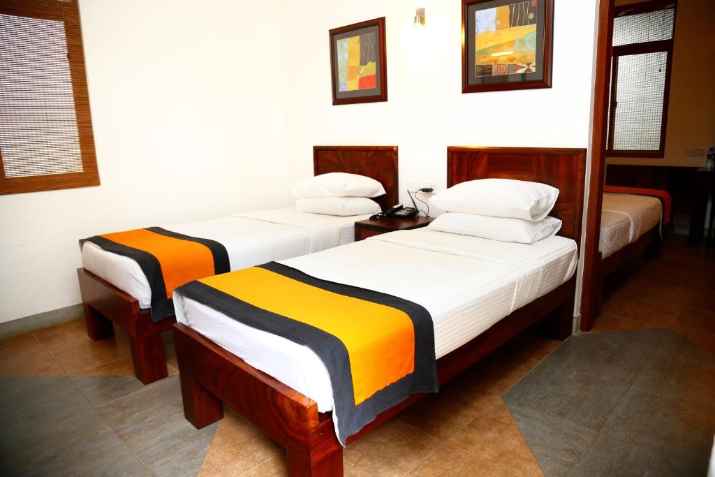 Postel nebo postele na pokoji v ubytování Spring Villas Kandy
