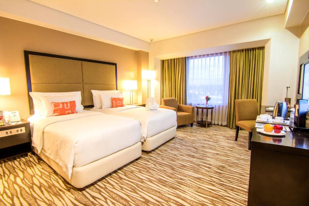 Postel nebo postele na pokoji v ubytování Acacia Hotel Manila