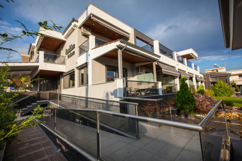 an image of a house with a balcony at Amalia Center in Nea Vrasna