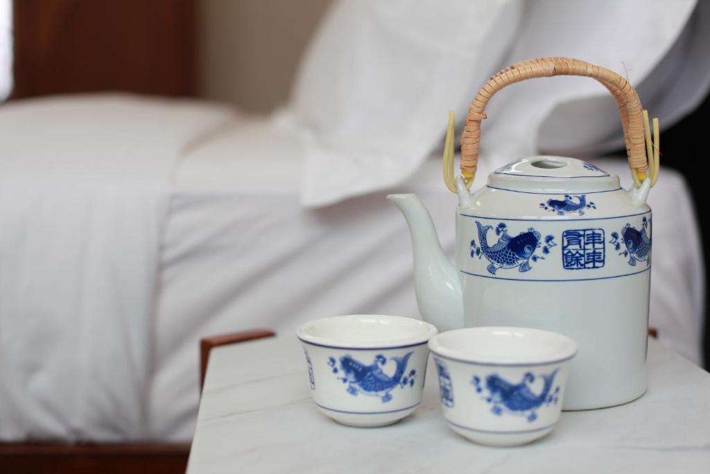 Postel nebo postele na pokoji v ubytování Tian Jing Hotel