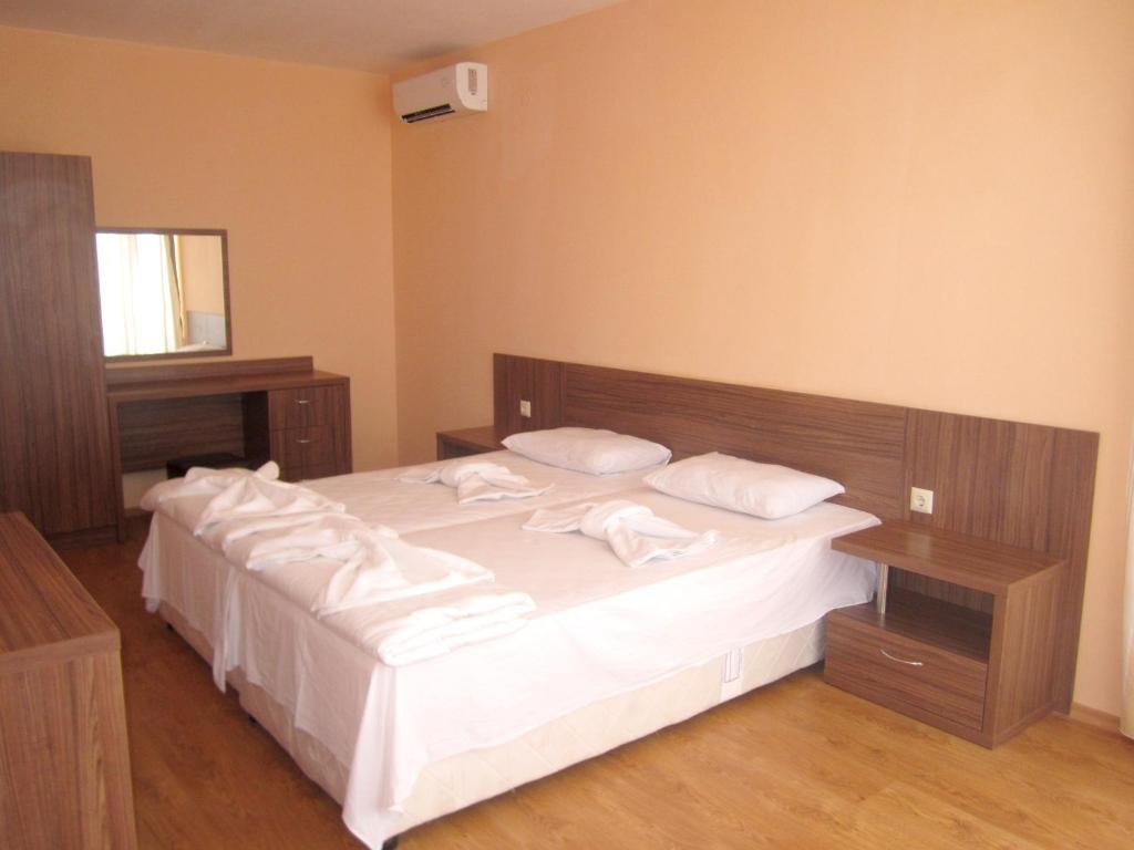 Postel nebo postele na pokoji v ubytování Hotel COOP Central