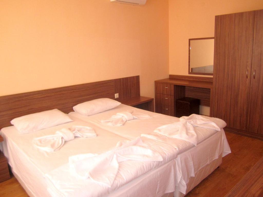 Postel nebo postele na pokoji v ubytování Hotel COOP Central