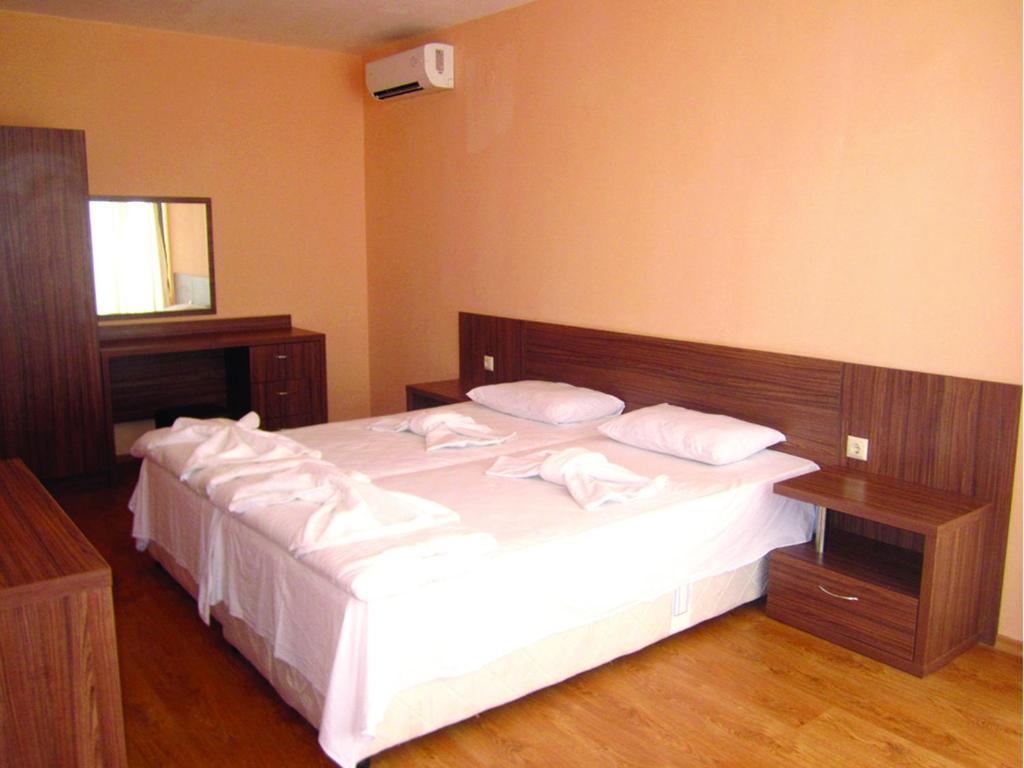 Postel nebo postele na pokoji v ubytování Hotel COOP Central
