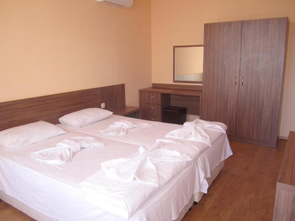 Postel nebo postele na pokoji v ubytování Hotel COOP Central