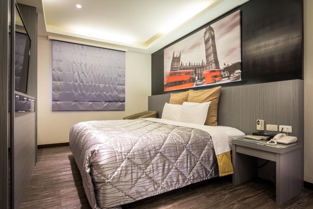 Postel nebo postele na pokoji v ubytování Carnival Motel