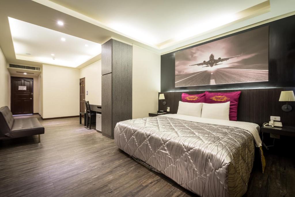 Postel nebo postele na pokoji v ubytování Carnival Motel