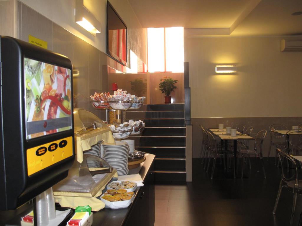 TV a/nebo společenská místnost v ubytování Hotel Mariano