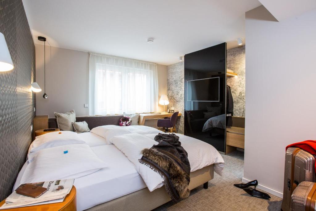 Postel nebo postele na pokoji v ubytování Hotel Boehler