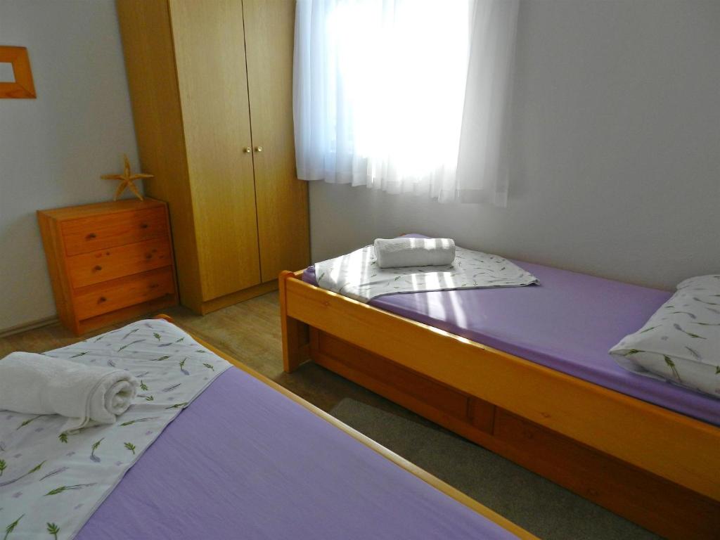 Posteľ alebo postele v izbe v ubytovaní House Damir