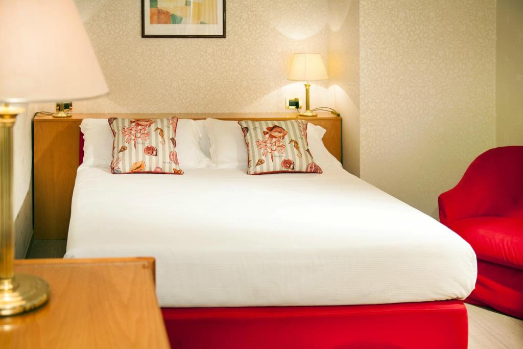 Postel nebo postele na pokoji v ubytování Hotel Kursaal