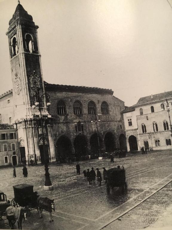 an old photo of a building with a clock tower at Res. CENTRO STORICO in Fano
