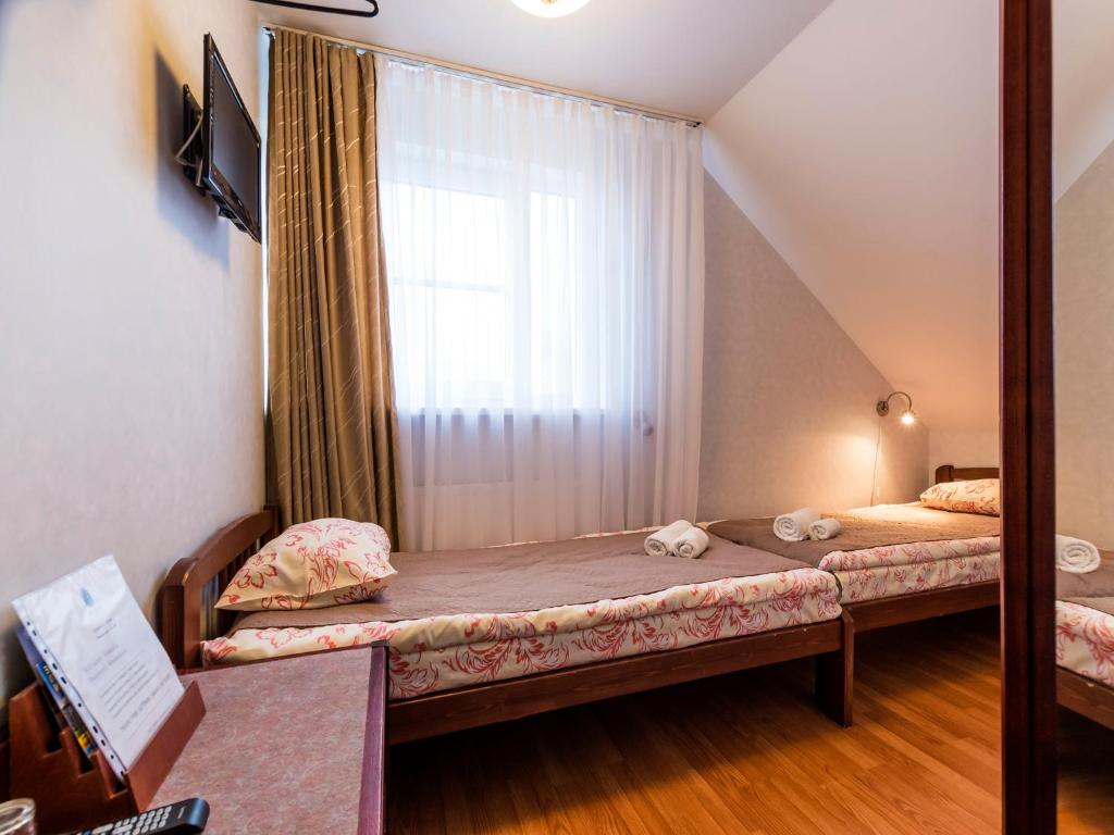 Postel nebo postele na pokoji v ubytování Humala Guest House