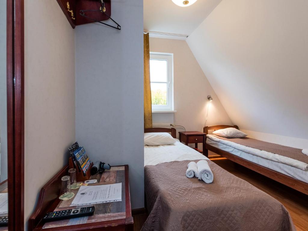 Postel nebo postele na pokoji v ubytování Humala Guest House