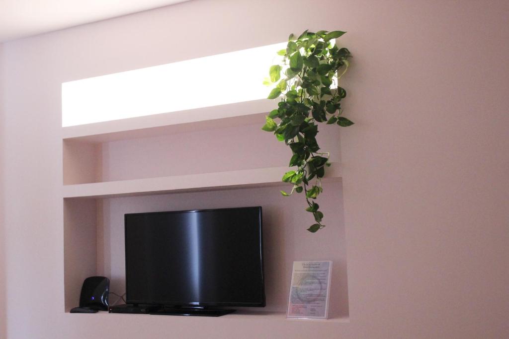 TV a/nebo společenská místnost v ubytování Apartments VMadeira