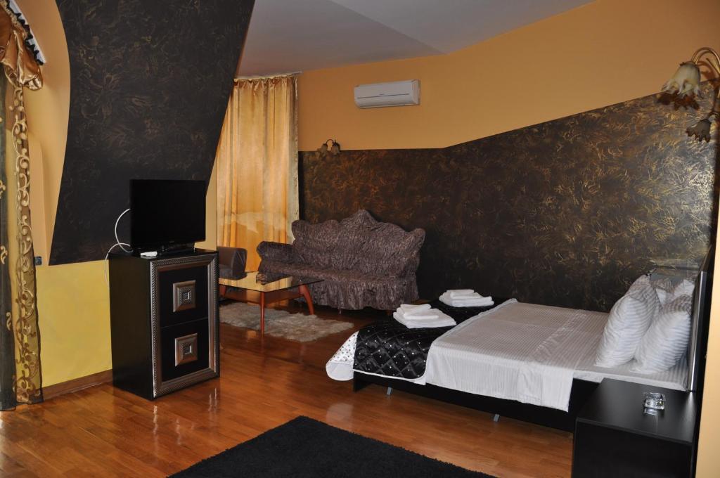 TV a/nebo společenská místnost v ubytování hotel amber