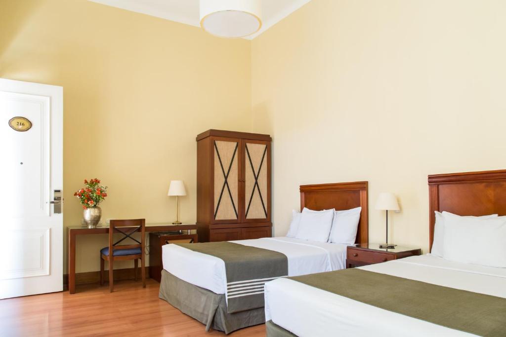 Postel nebo postele na pokoji v ubytování LP Los Portales Hotel Piura