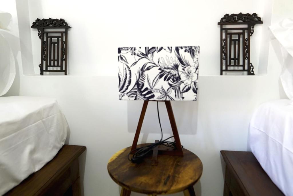 Postel nebo postele na pokoji v ubytování ANGKOR DINO B&B