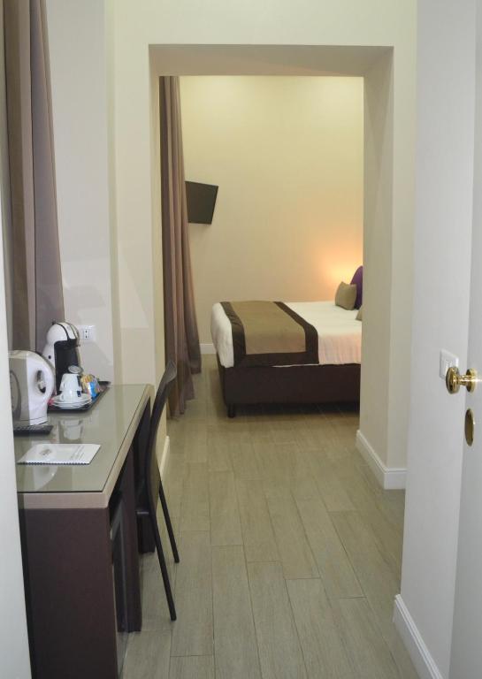 A bed or beds in a room at Bloom Apartment by La Griffe