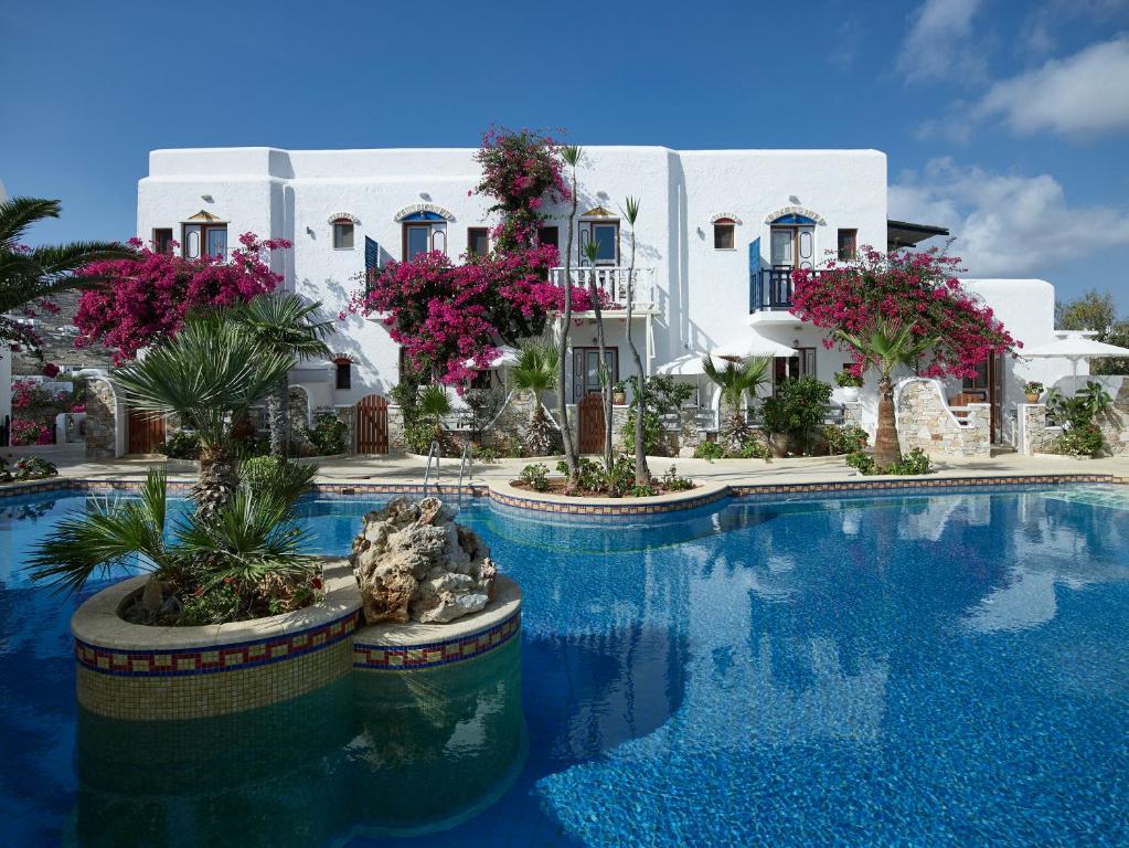 a resort with a swimming pool in front of a building at Polikandia Hotel in Chora Folegandros