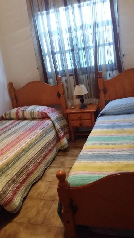 Postel nebo postele na pokoji v ubytování Apartamento en piscinas naturales.