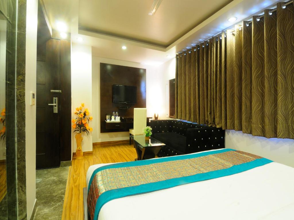 Postel nebo postele na pokoji v ubytování Hotel Elegance