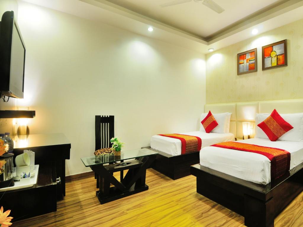 Postel nebo postele na pokoji v ubytování Hotel Elegance