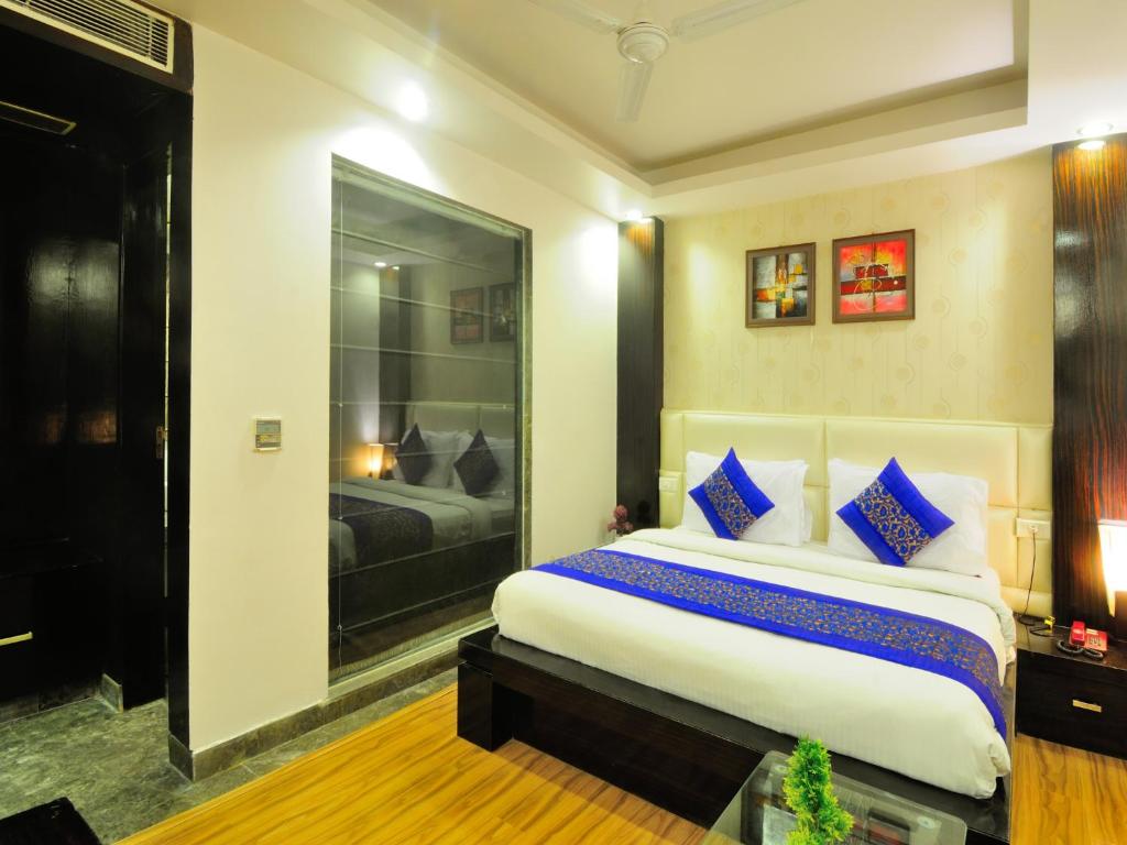 Postel nebo postele na pokoji v ubytování Hotel Elegance