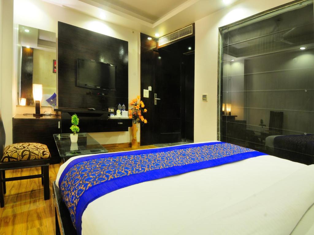 Postel nebo postele na pokoji v ubytování Hotel Elegance