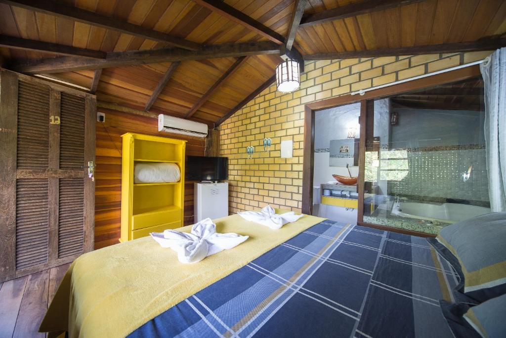 Cama ou camas em um quarto em Pousada Favo De Mel