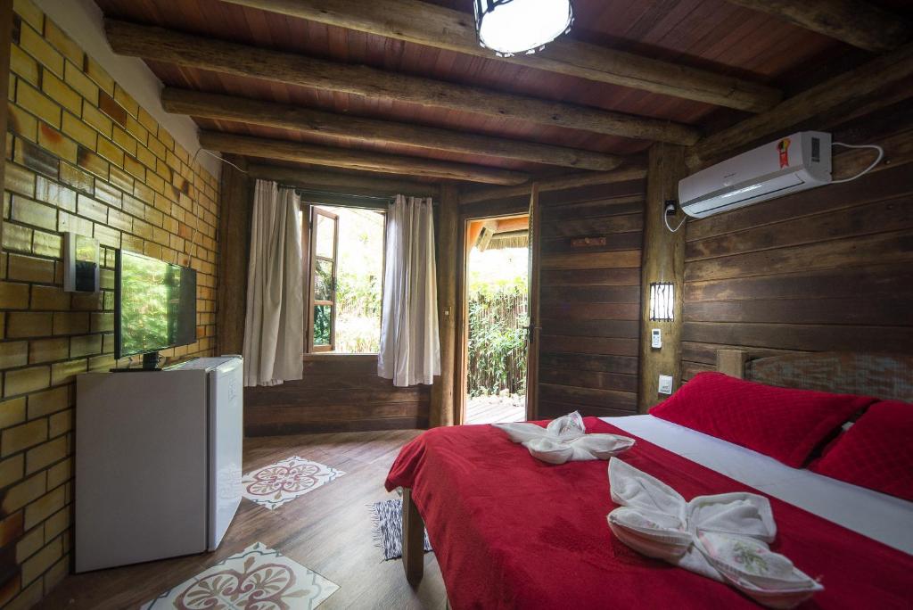 Cama ou camas em um quarto em Pousada Favo De Mel