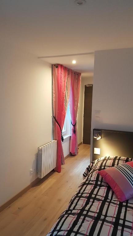 Postel nebo postele na pokoji v ubytování Caveau de l'ami Fritz