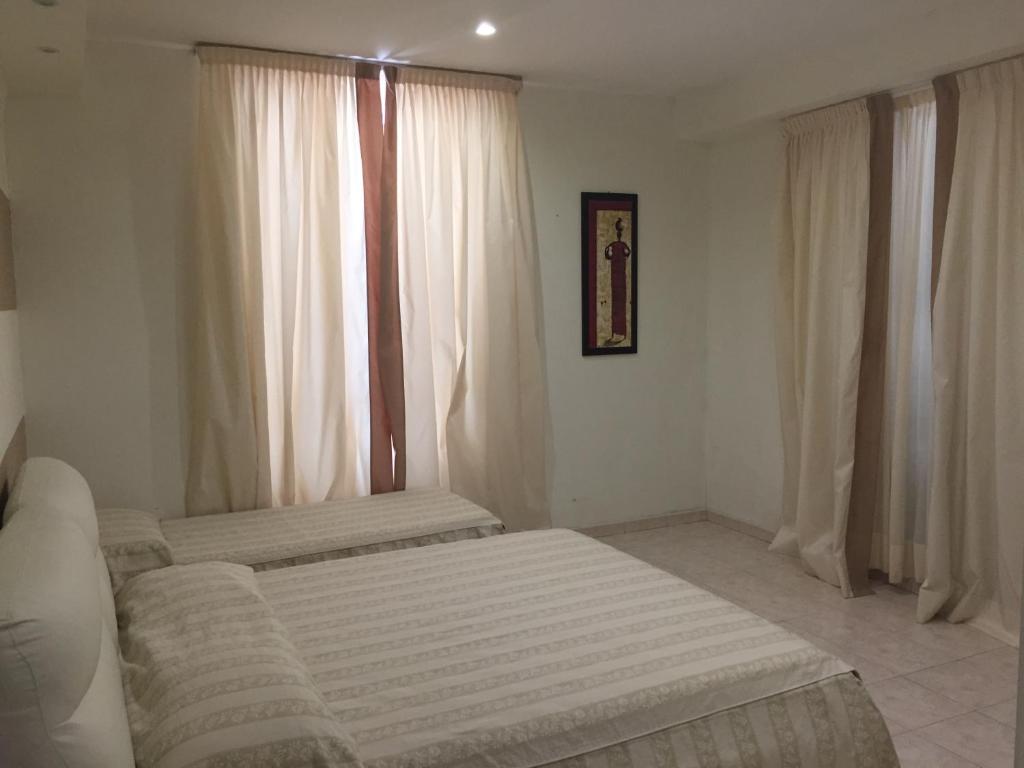 Postel nebo postele na pokoji v ubytování Villa Accini