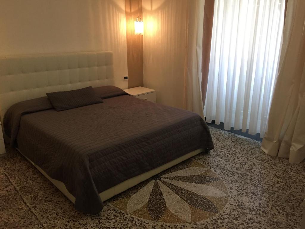 Postel nebo postele na pokoji v ubytování Villa Accini