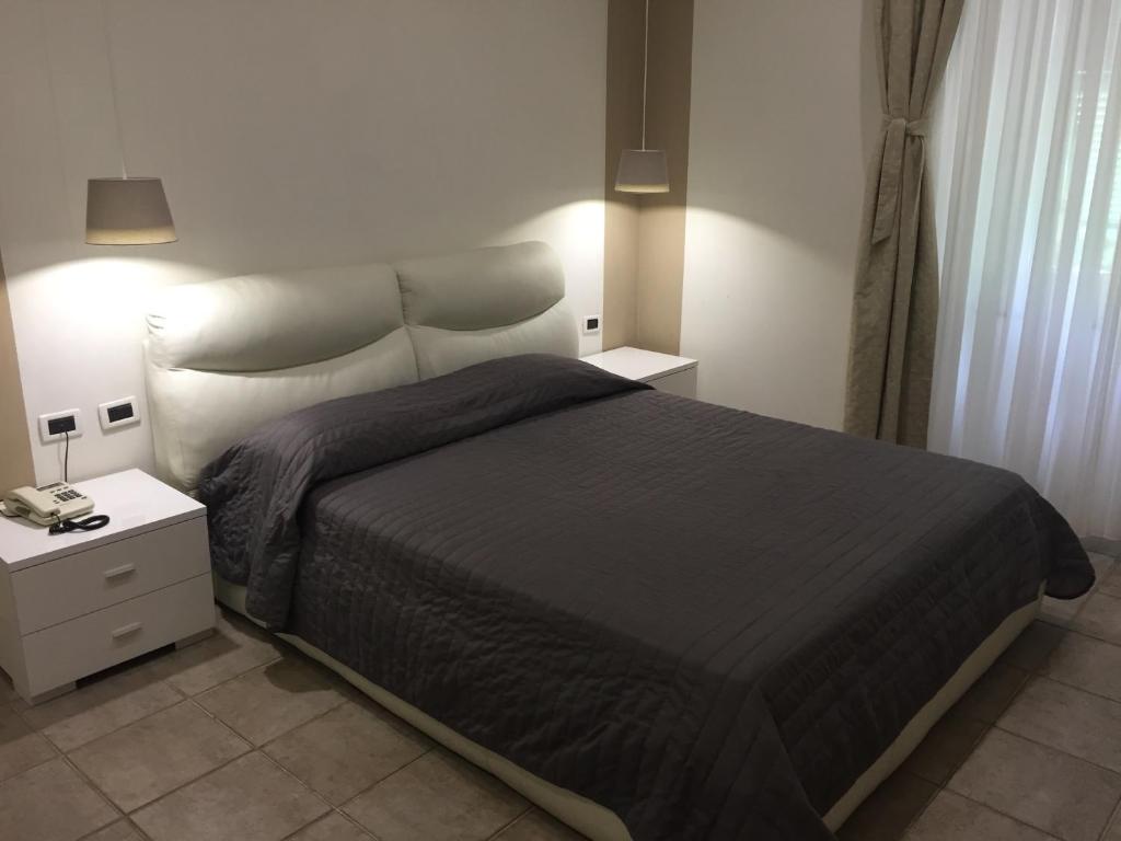 Postel nebo postele na pokoji v ubytování Villa Accini