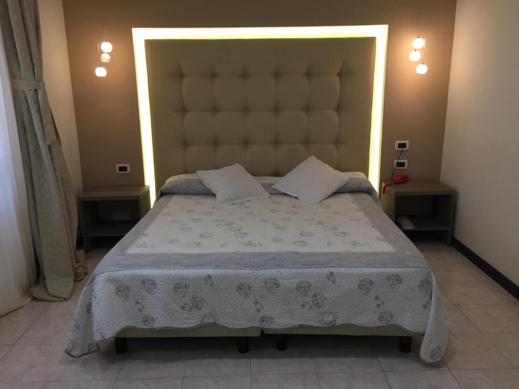 Postel nebo postele na pokoji v ubytování Villa Accini