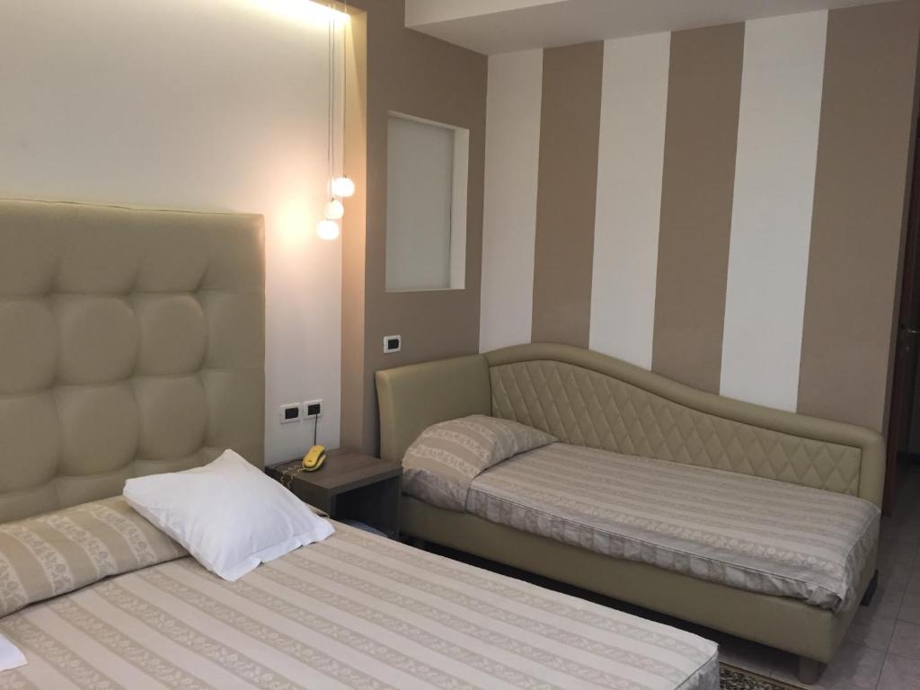 Postel nebo postele na pokoji v ubytování Villa Accini