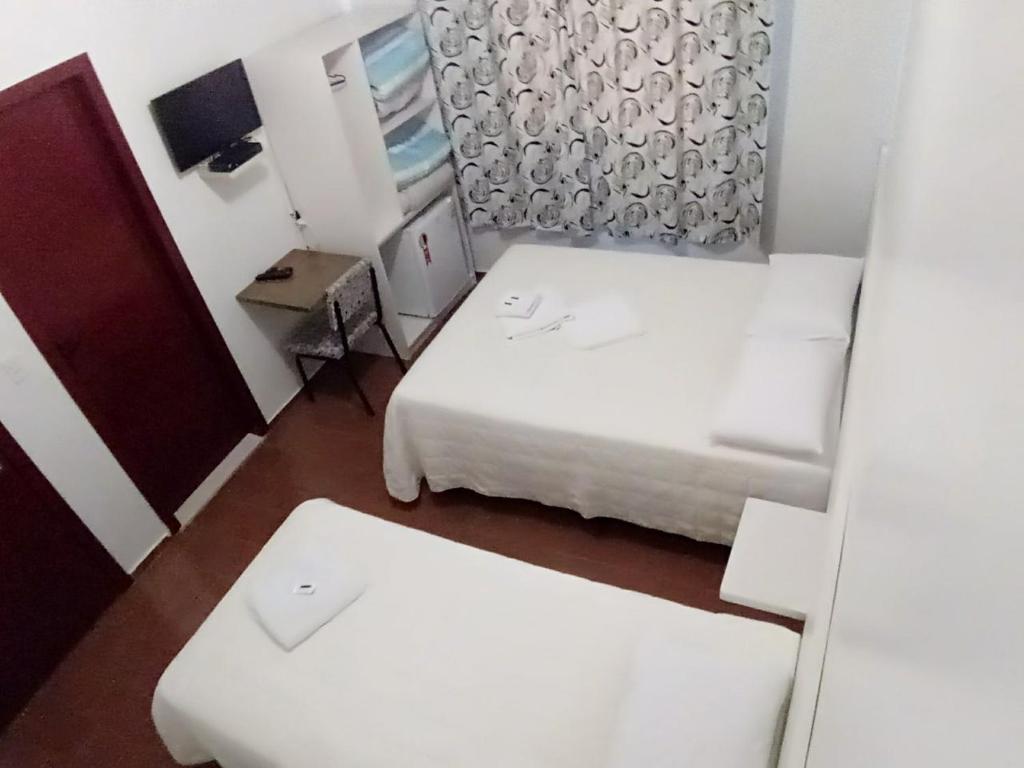 Postel nebo postele na pokoji v ubytování Giroto Hotel