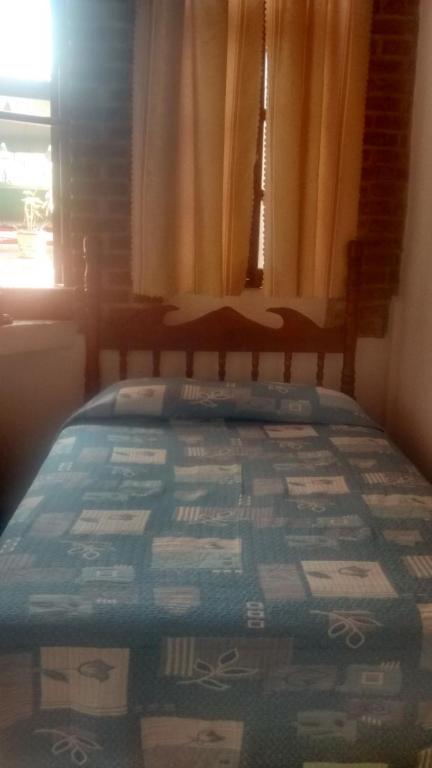 Postel nebo postele na pokoji v ubytování Real Bonanza Posada