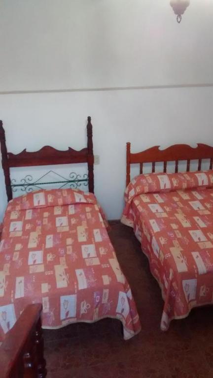 Postel nebo postele na pokoji v ubytování Real Bonanza Posada