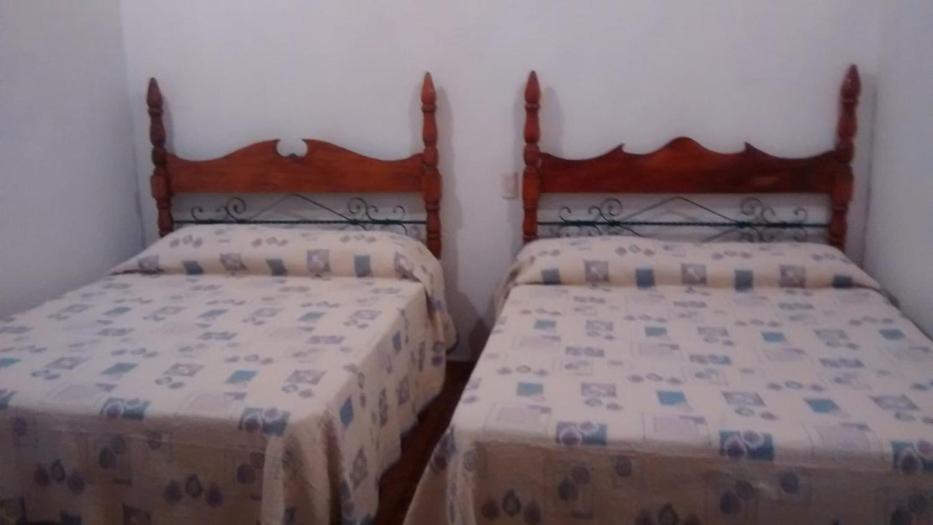 Postel nebo postele na pokoji v ubytování Real Bonanza Posada