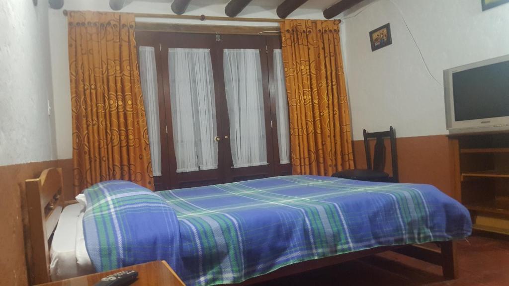 Postel nebo postele na pokoji v ubytování La Posada Pyg