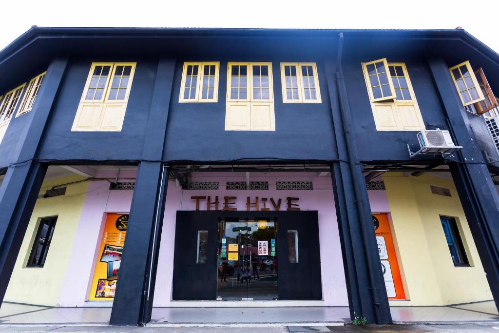 a black building with the line written on it at The Hive Singapore Hostel in Singapore