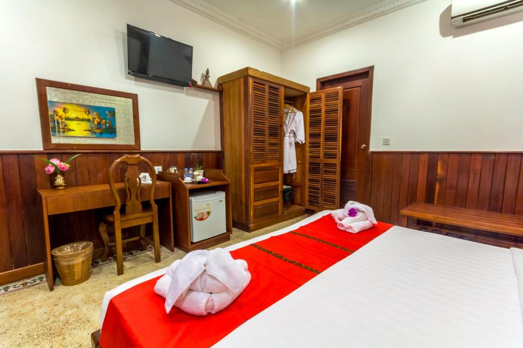 Postel nebo postele na pokoji v ubytování BayStone Resort