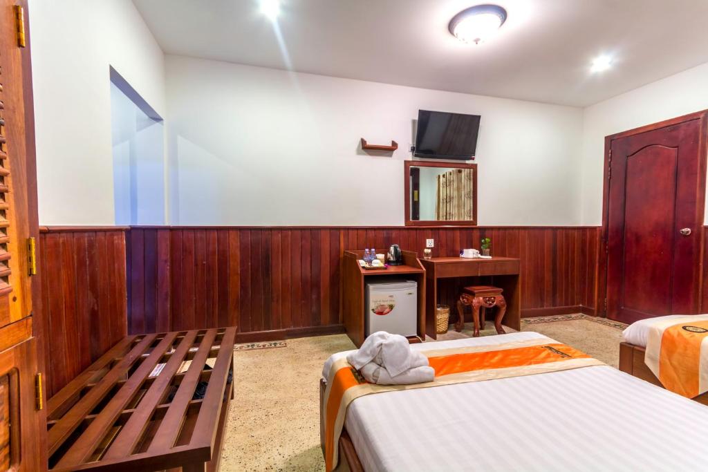 Postel nebo postele na pokoji v ubytování BayStone Resort