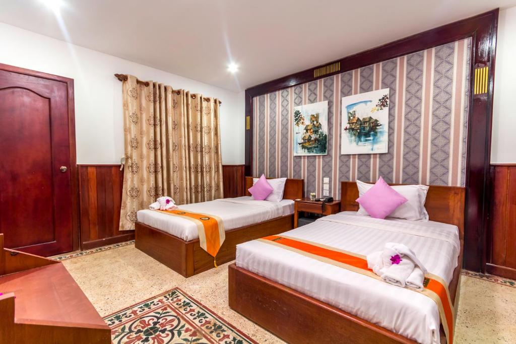 Postel nebo postele na pokoji v ubytování BayStone Resort