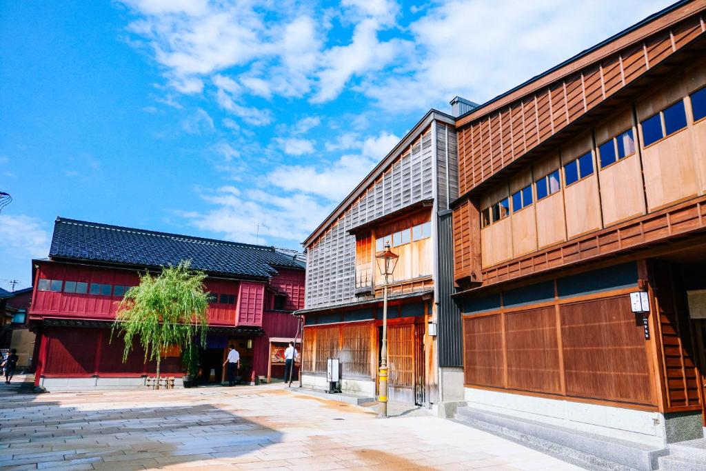 a group of buildings on a city street at Kanazawa Hakuchoro Hotel Sanraku -Natural Hot Spring- in Kanazawa
